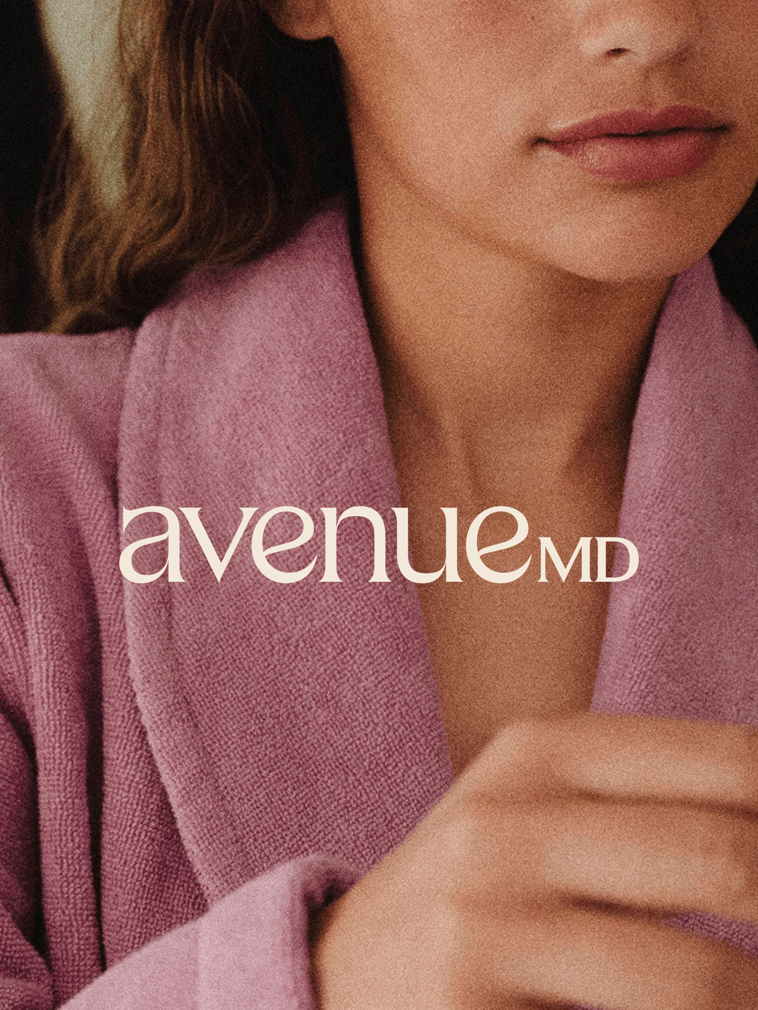 Image of AvenueMD logo in front of a person